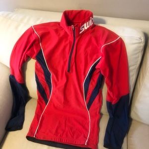 Swix base layer 1/2 zippered womens size s red / black with  white piping .